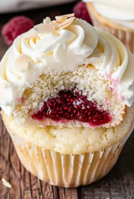 Almond Wedding Cake Cupcakes with Raspberry Filling